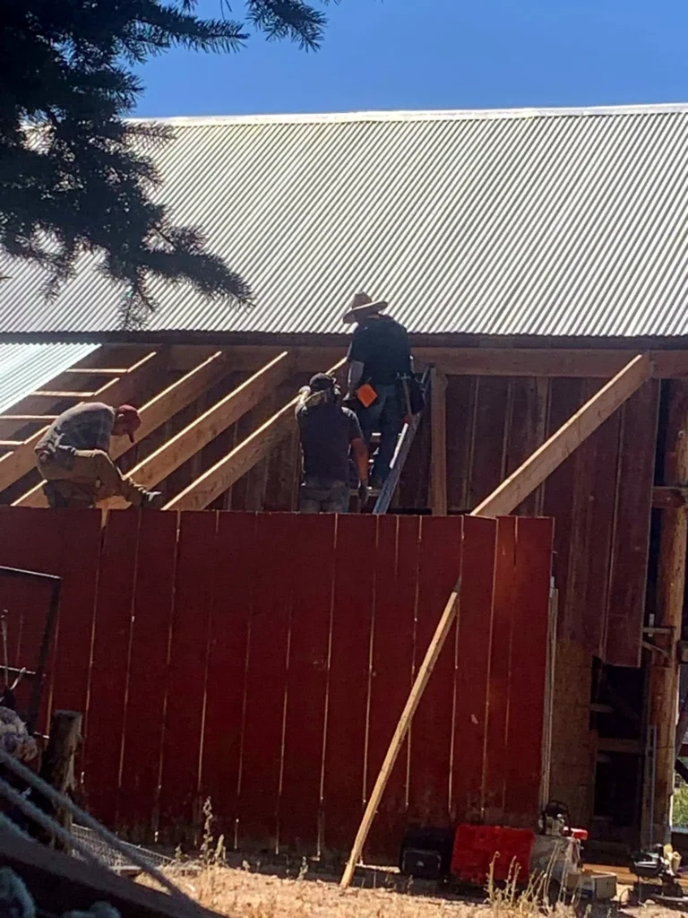 Freshly painted red barn siding with clean edges
