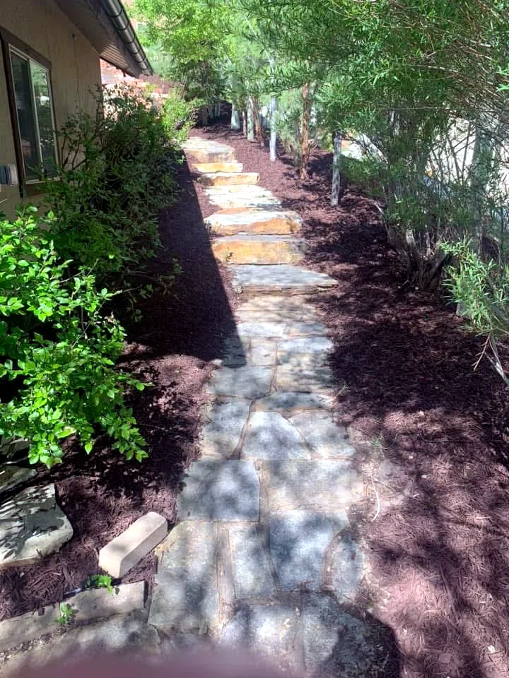 Boulder wall and terraced landscaping at a Wasatch County property