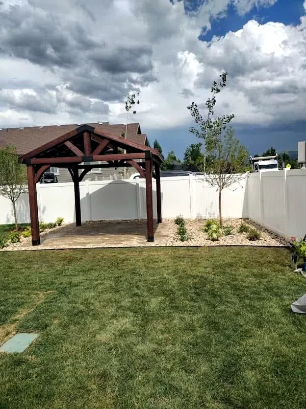 Finished pergola with new sod and young trees