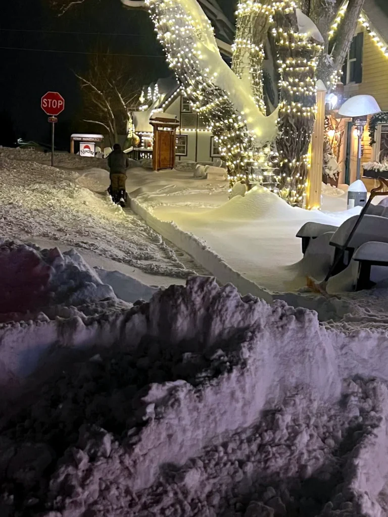 Snow removal from a residential roof in Heber City, Utah